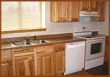 Enjoy all your favorite meals and snacks while on vacation in eagle Nest, New Mexico, this fully equipped kitchen has a full size oven and dishwasher, coffee maker, microwave, double sink and granite countertops.